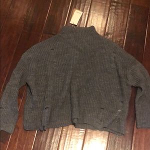 Italian brand sweater with intentional rip detail